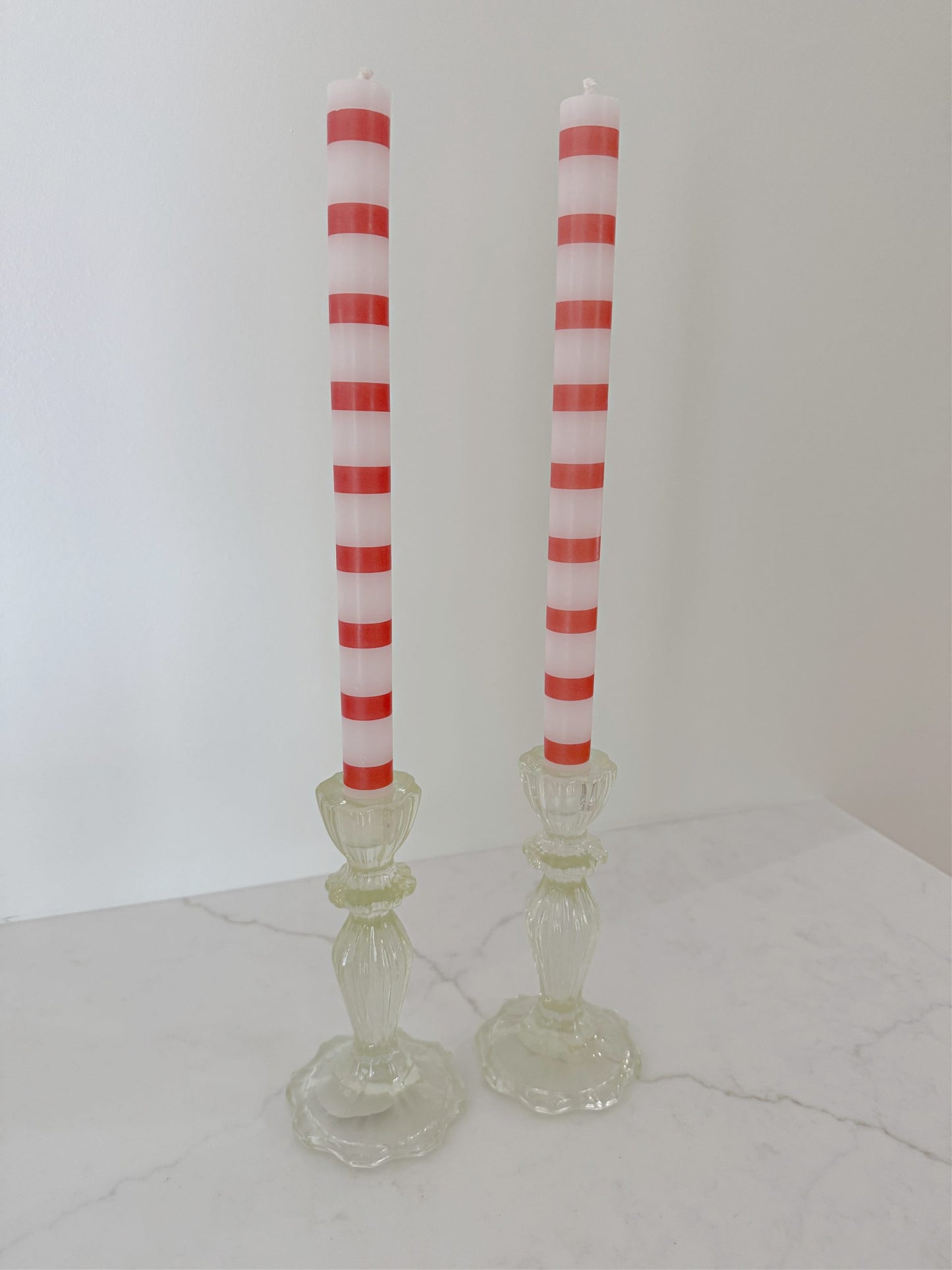 Single Red and White Striped Taper Candle