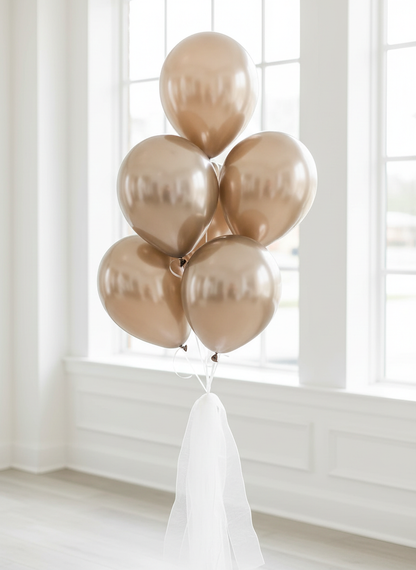 Champagne gold chrome balloon bouquet with white organza ribbons