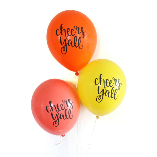 Cheers Y'all balloons in citrus colors - orange grapefruit and lemon shades