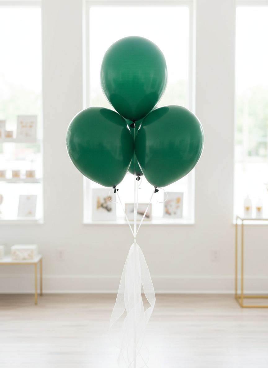 Emerald green balloon bouquet with white organza ribbons