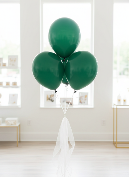 Emerald green balloon bouquet with white organza ribbons