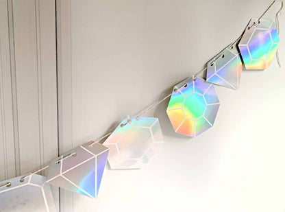 Get ready to dance the night away with our Last Disco Bachelorette Garland with Iridescent Diamond Cutouts. This stunning garland features 17 iridescent diamond cutouts that shimmer and shine, making it the perfect choice for a bachelorette party or any other celebration. The iridescent finish adds a touch of glamour and sparkle, making it a versatile choice for a variety of themes and color schemes. Whether you're decorating a venue or simply adding a touch of fun to your room, this garland is sure to brin