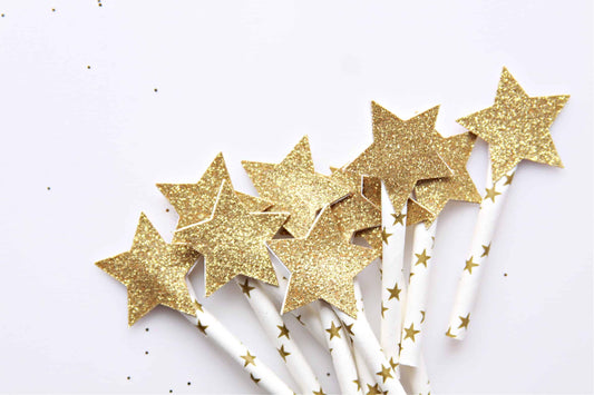 Gold glitter star cupcake or cake toppers on celestial star picks