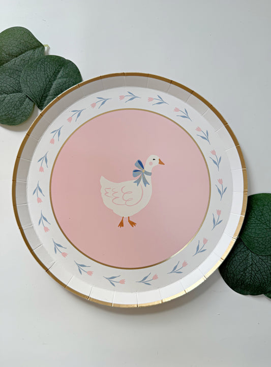 one silly goose plates - dessert size in pink with a goose with a blue bow for baby showers and birthday parties