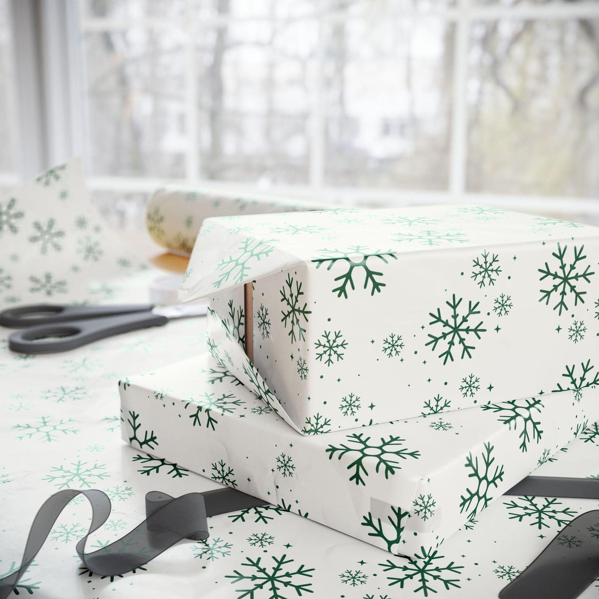 Elegant luxury Christmas gift wrap in sage and emerald shades with snowflakes for a winter theme. Perfect for a Baby It's Cold outside baby shower or birthday party..