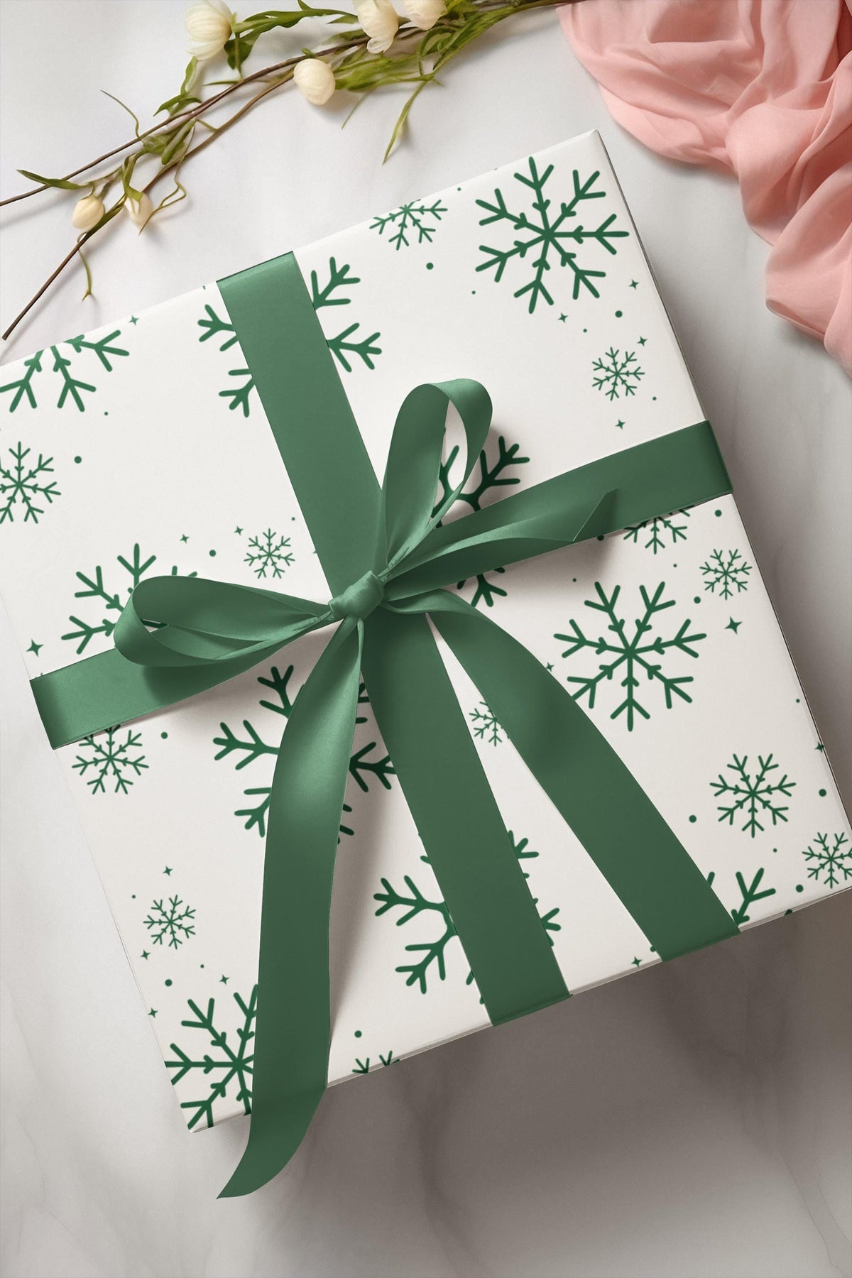 Elegant luxury Christmas gift wrap in sage and emerald shades with snowflakes for a winter theme. Perfect for a Baby It's Cold outside baby shower or birthday party..