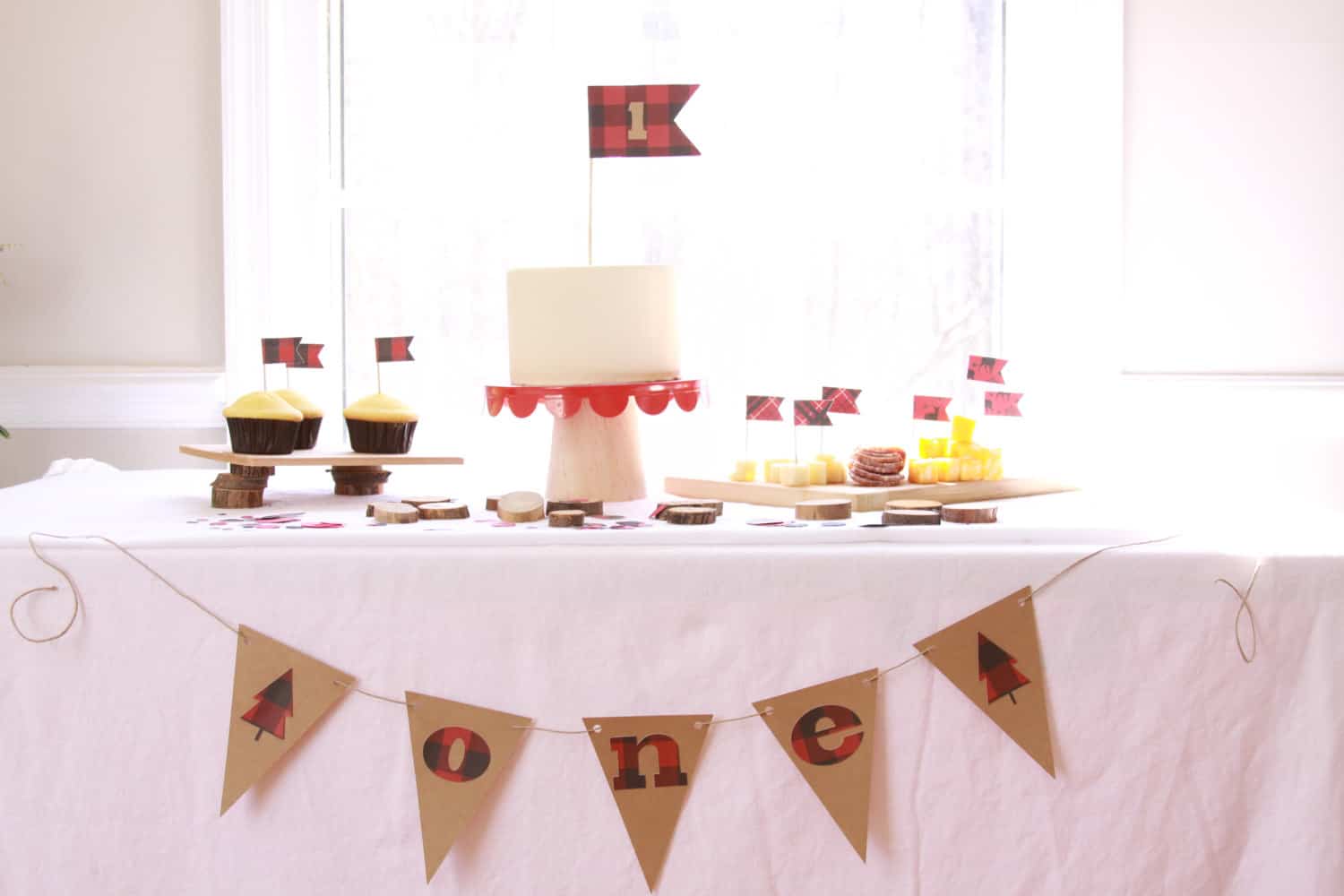 Wild one first birthday party decor in black and red buffalo check