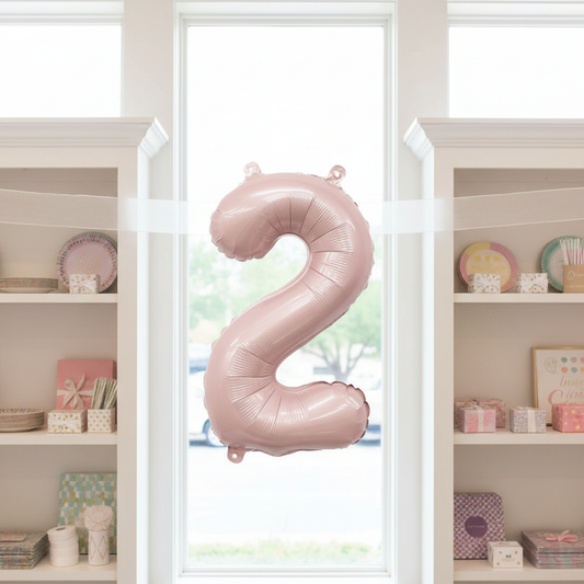 Matte Blush Number 2 Balloon Between Bookcases