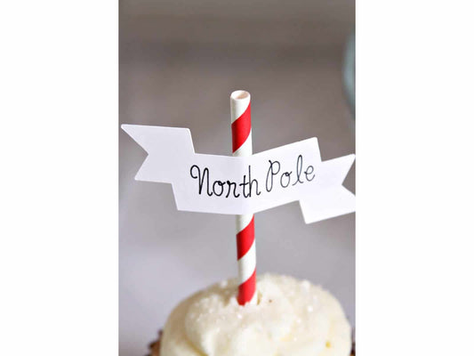 North Pole Cupcake Topper on a cupcake with sparkly sprinkles