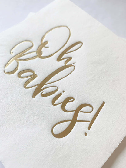 The gorgeous gold foiled scripted writing on these Oh Babies cocktail napkins looks elegant on a neutral white background. Use the napkins for treats and to protect those baby shower outfits! All that's left to do is enjoy this special moment at the twin's baby shower with family and friends.
