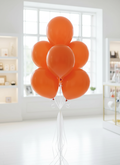 Orange balloon bouquet with white organza ribbons