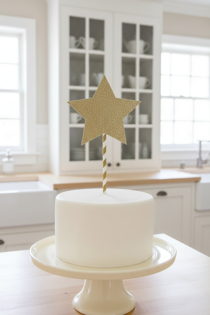 Oversized gold star topper on white cake