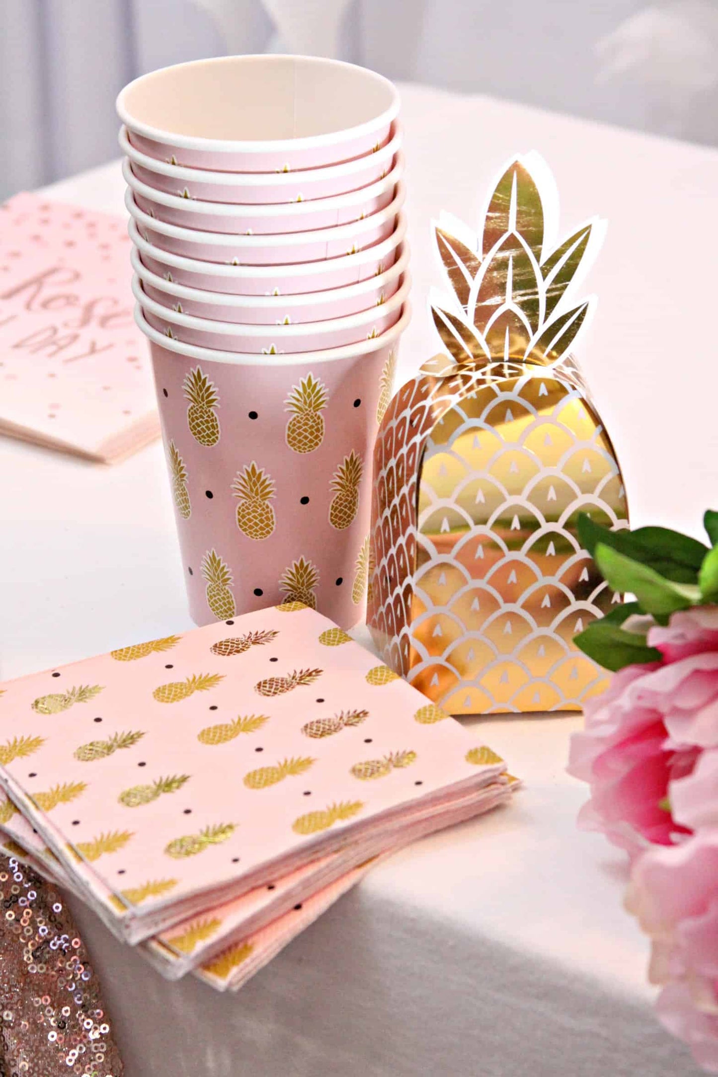 Gold pineapple cocktail napkins and cups with our gold foil pineapple favor boxes for tropical themed events