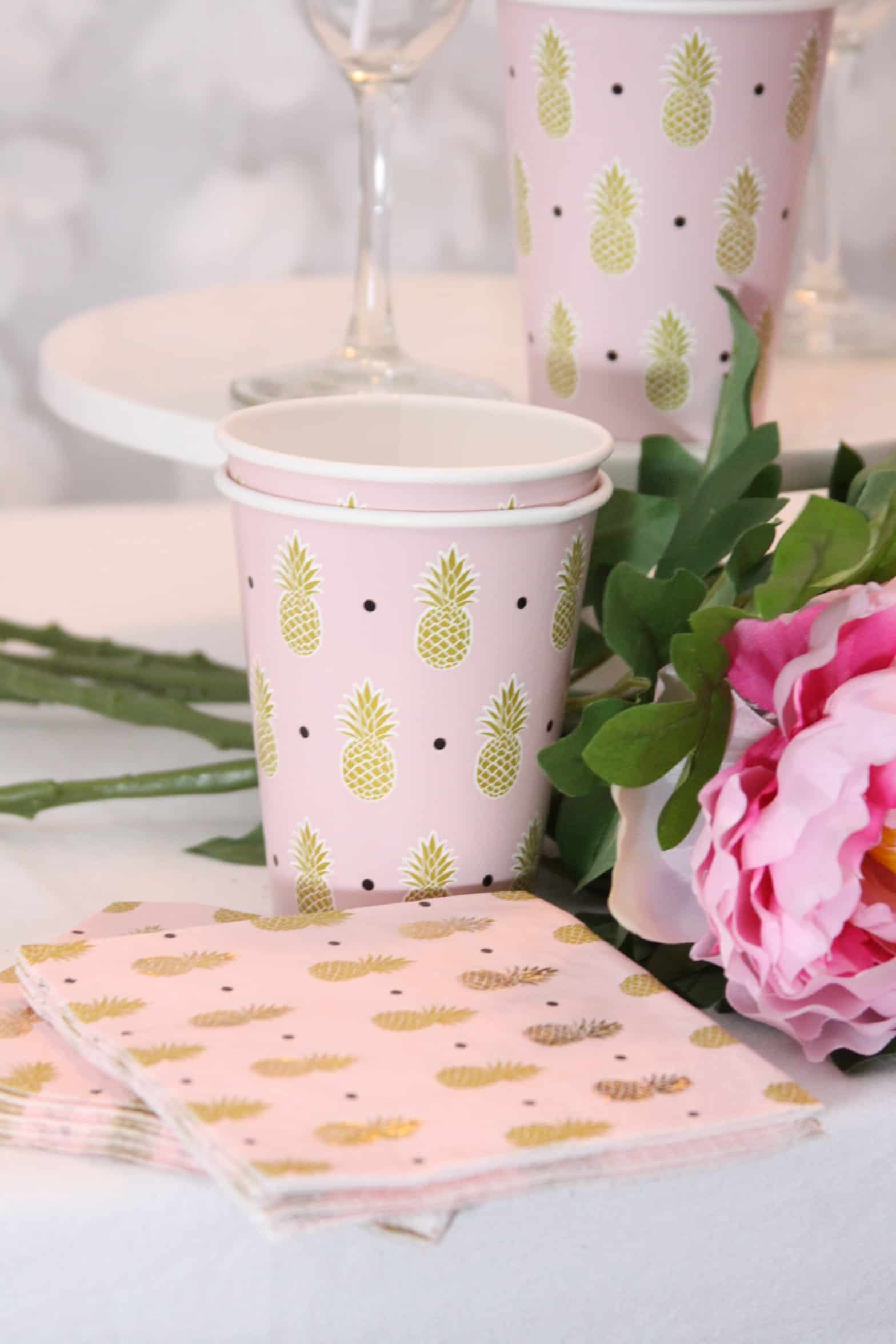 Bring a touch of tropical paradise to your next party with our Pink Pineapple Pool Party in a Box. Set includes 8 cups, 8 pineapple plates, and 16 pink and gold pineapple napkins. Perfect for a bridal shower, bachelorette, or pool party. #PineapplePoolParty #PinkPineapple #SummerParties