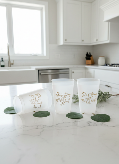 She's Tying the Knot gold cups with greenery
