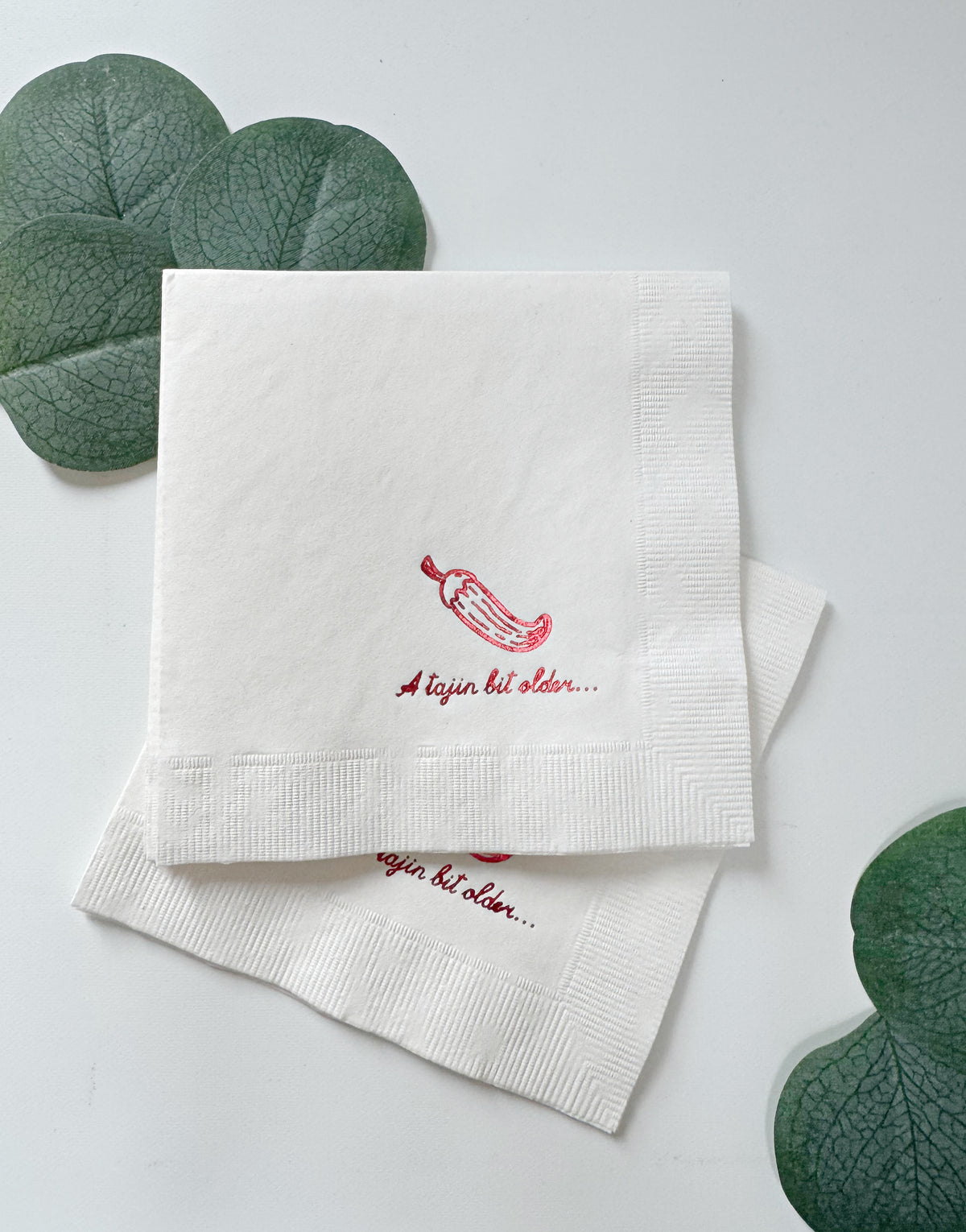 
    A Tajin Bit Older Cocktail Napkins Red on White - Fiesta Birthday Cinco de Mayo Party, the designer-recommended anchor napkin for the A Tajin Bit Older Birthday Collection collection
  