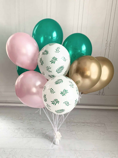 Set of 12 Girl Dinosaur Balloons in shades of pink, green, gold, and tropical palm print. Perfect for decorating any dinosaur, tropical or fiesta themed party. Balloons are sold uninflated with assembly required.