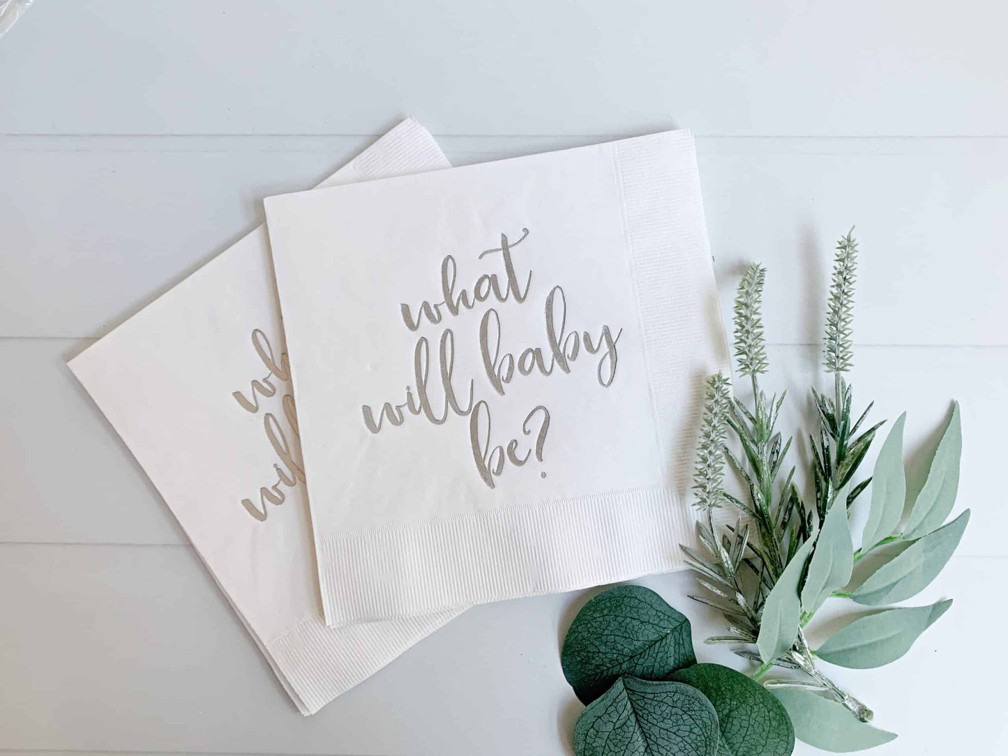 These fab white gender-reveal paper napkins are the finishing touch for your gender-reveal party! Each napkin has a beautiful script "What will baby be?" in silver foil. The neutral colors mean these are perfect for a gender-neutral theme. Combine these with our silver and white tableware in the shop!